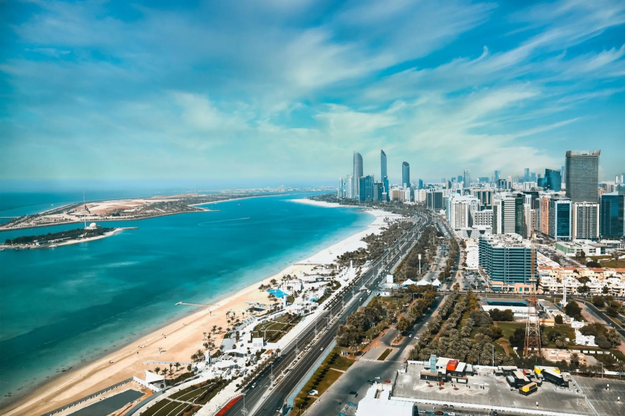 Aerial view of the Abu Dhabi coastline, beach and city towers