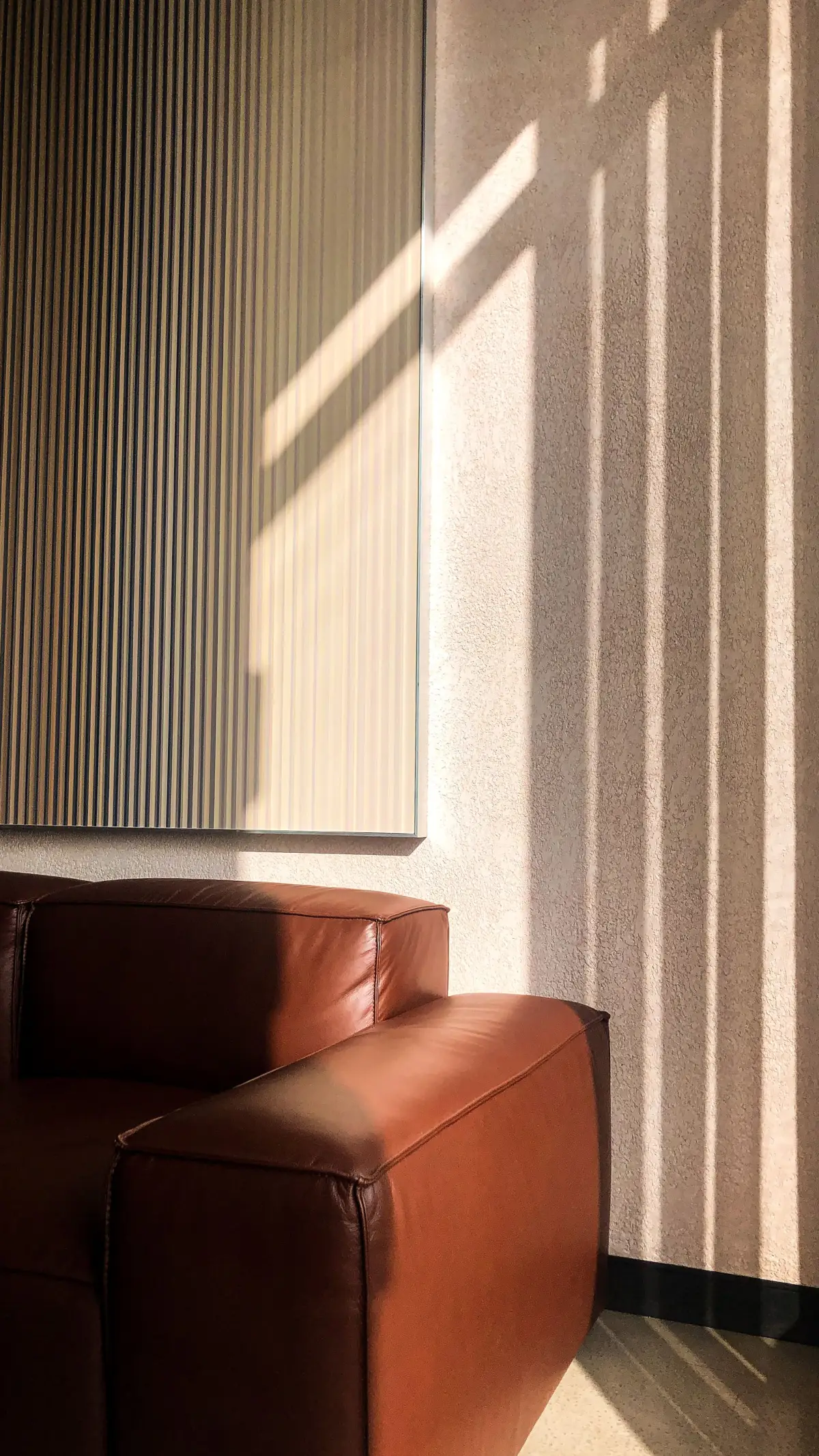 Interior with soft light, shadow and leather furnishing